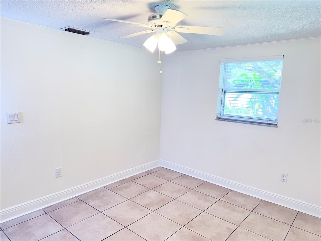 5701 Quist Drive Port Richey, FL 34668 - Photo 14 of 53 a view of an empty room with a window