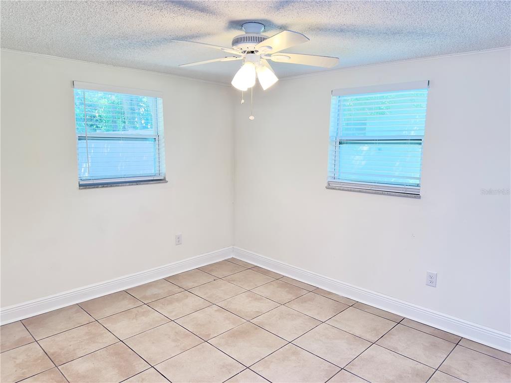 5701 Quist Drive Port Richey, FL 34668 - Photo 16 of 53 a view of an empty room with a window
