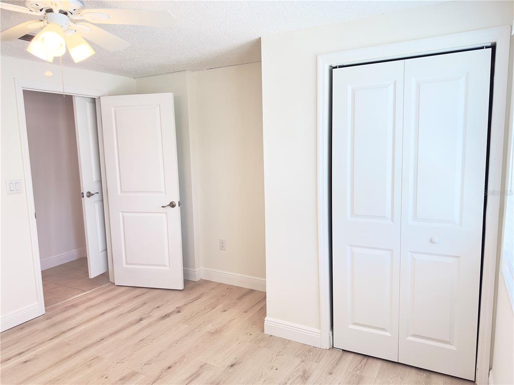 5701 Quist Drive Port Richey, FL 34668 - Photo 19 of 53 a view of a room with wooden floor and closet area