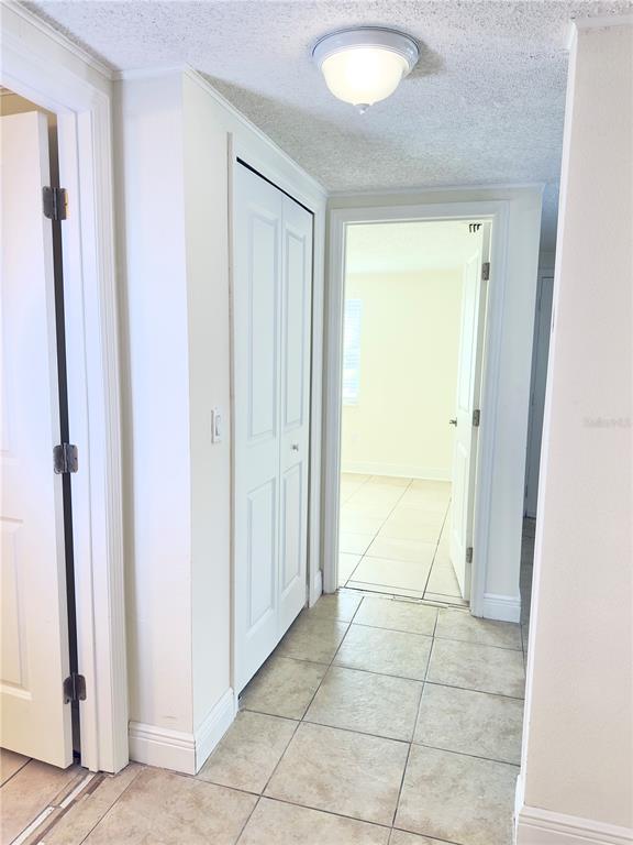 5701 Quist Drive Port Richey, FL 34668 - Photo 22 of 53 an empty room with a door