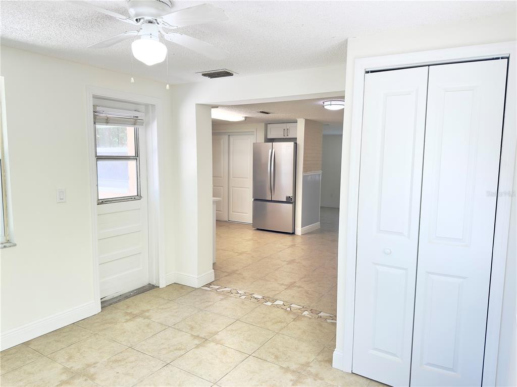 5701 Quist Drive Port Richey, FL 34668 - Photo 32 of 53 an empty room with closet and a chandelier fan