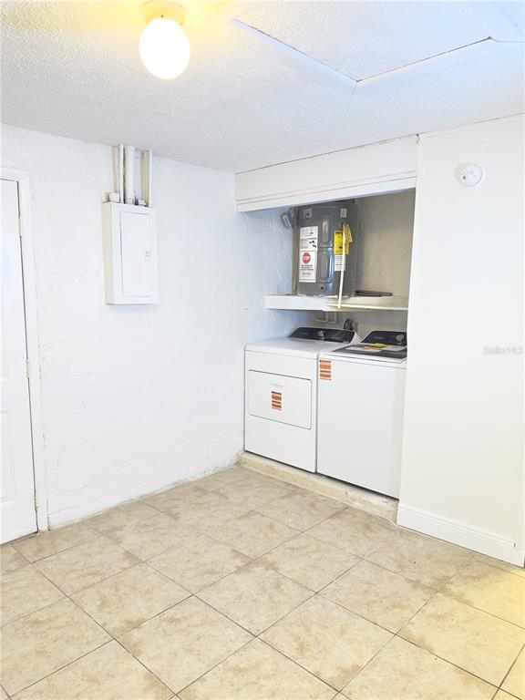 5701 Quist Drive Port Richey, FL 34668 - Photo 35 of 53 a kitchen with granite countertop a sink and a stove