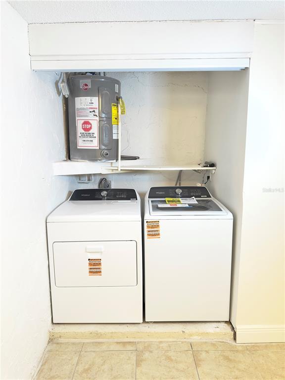 5701 Quist Drive Port Richey, FL 34668 - Photo 36 of 53 a utility room with dryer and washer