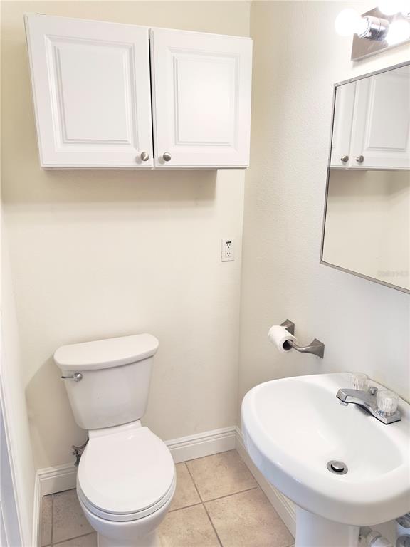 5701 Quist Drive Port Richey, FL 34668 - Photo 41 of 53 a white toilet sitting next to a bathroom sink