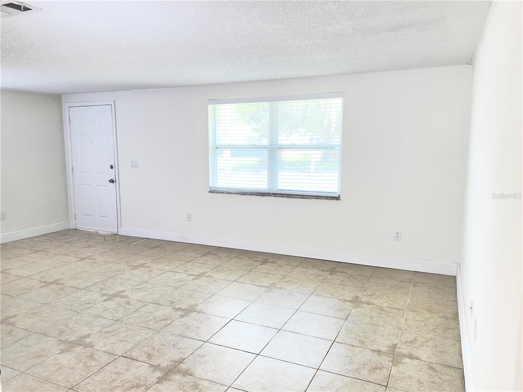 5701 Quist Drive Port Richey, FL 34668 - Photo 6 of 53 an empty room with a window