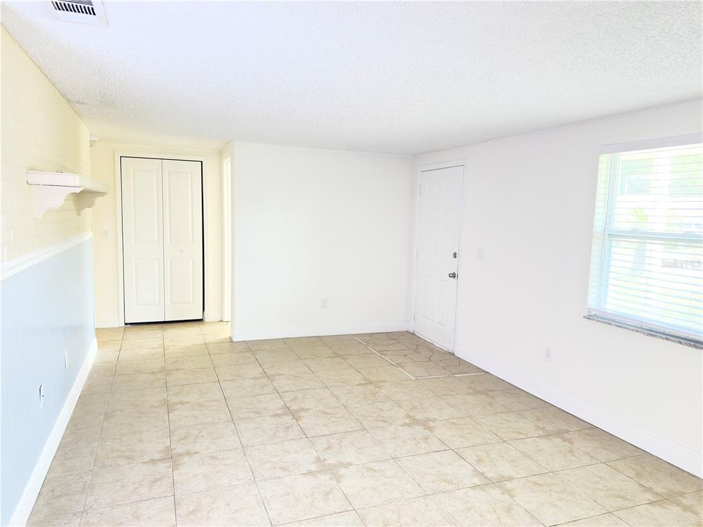 5701 Quist Drive Port Richey, FL 34668 - Photo 7 of 53 an empty room with a natural light
