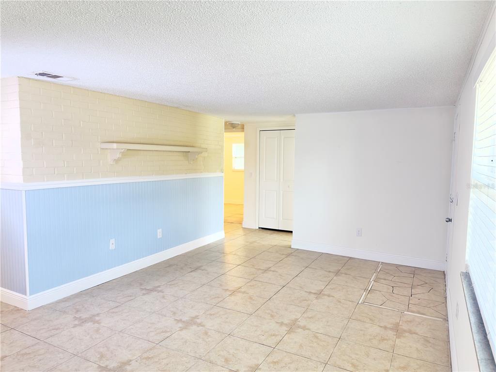 5701 Quist Drive Port Richey, FL 34668 - Photo 8 of 53 an empty room with a natural light