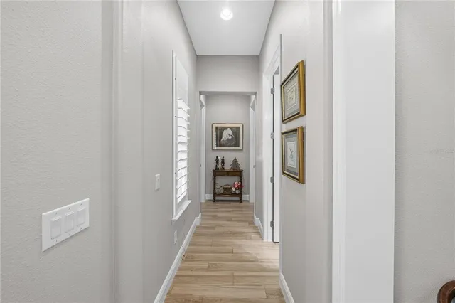 a front view of a house with a garden and yard