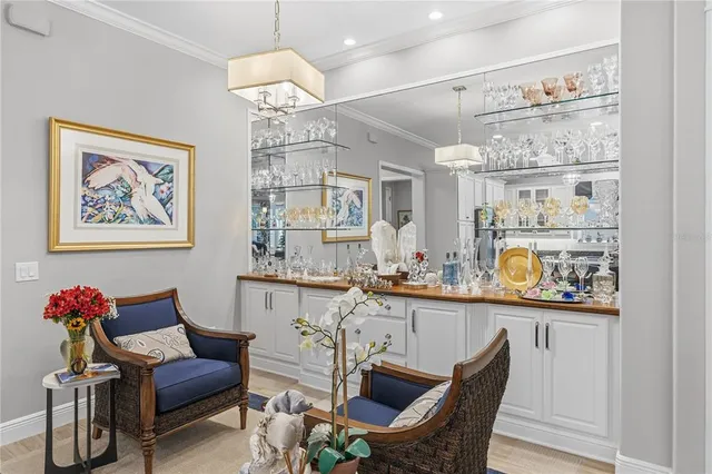 a living room with furniture and a mirror