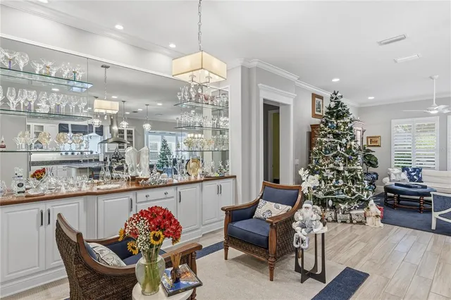 a view of a hallway with wooden floor and entryway