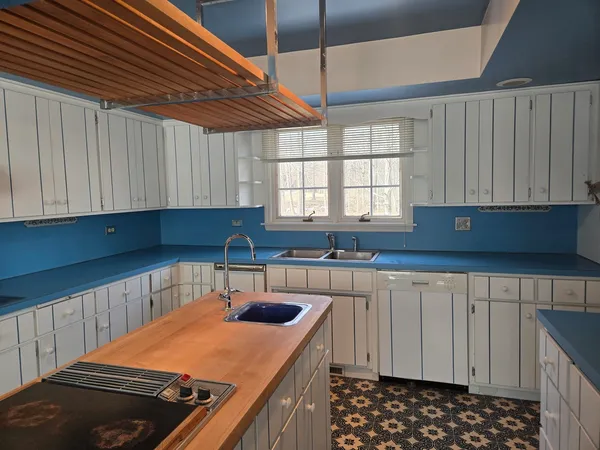 a kitchen with stainless steel appliances a refrigerator and cabinets