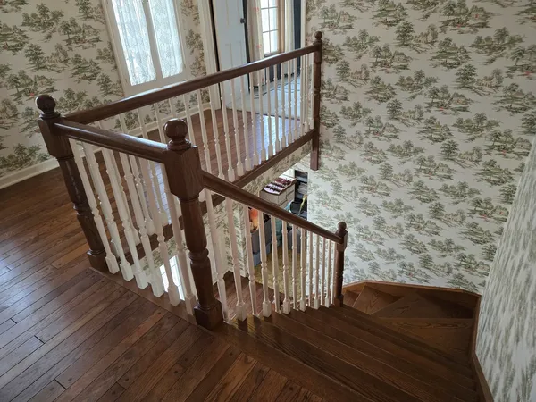 a view of an empty room with wooden walls
