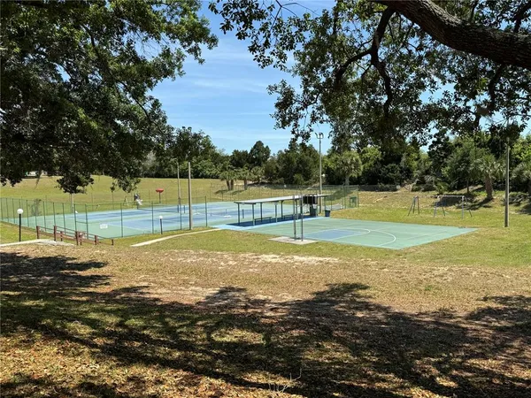 a view of a water with a yard