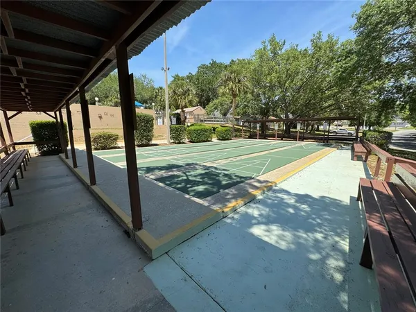 a view of a swimming pool with a patio