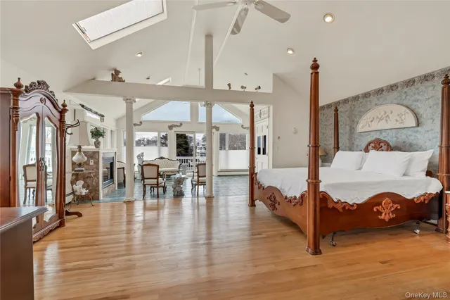 a spacious bathroom with a granite countertop sink a mirror and a shower
