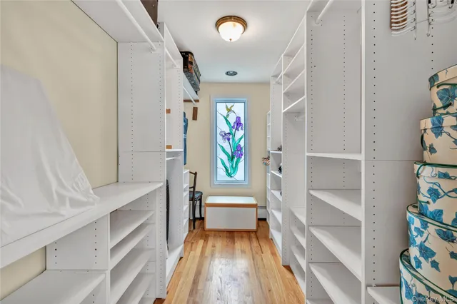 an aerial view of residential houses with outdoor space and lake view