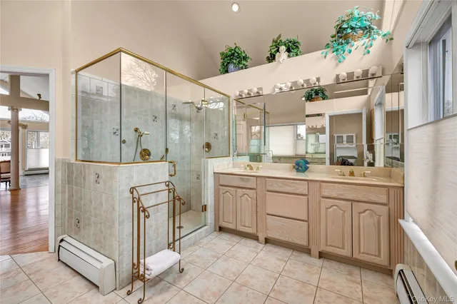 an aerial view of house with yard and lake view