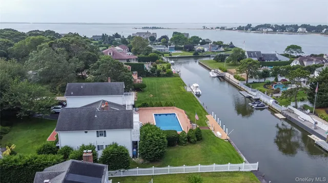 a view of a lake with houses in the back