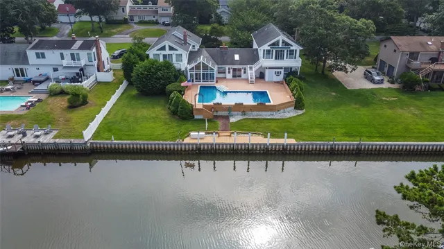 an aerial view of a house with a lake view