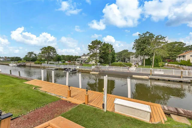 a front view of a house with a yard table and chairs