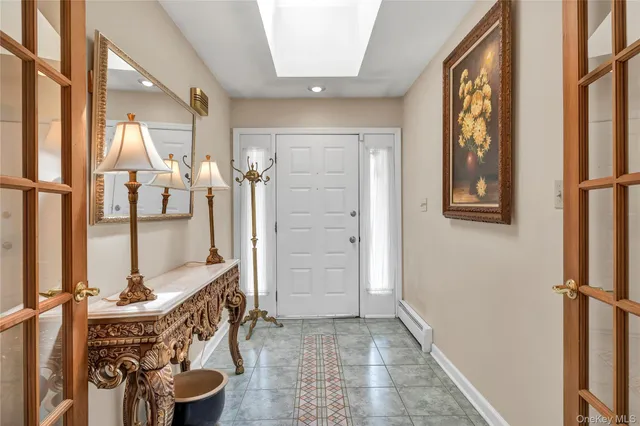 a view of an entryway with wooden floor