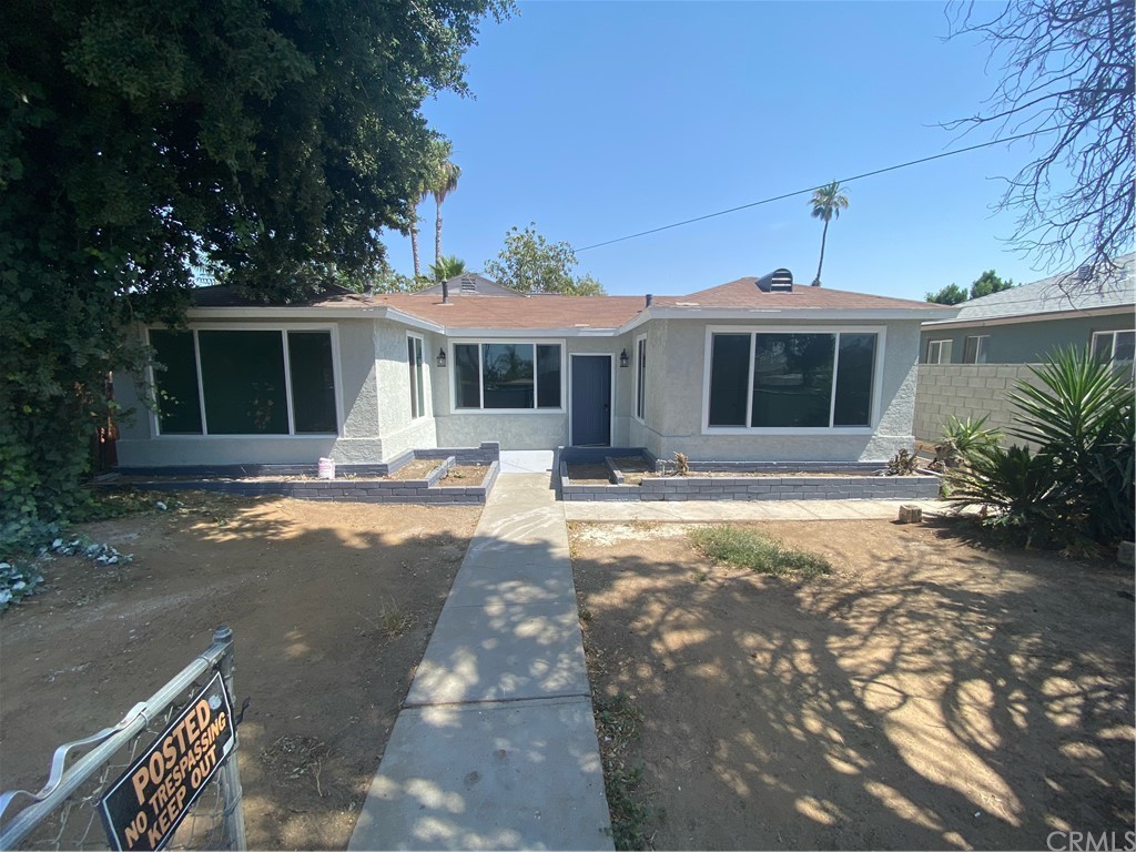 7572 Fern Avenue Riverside, CA 92504 - Photo 1 of 1 a front view of a house with a yard