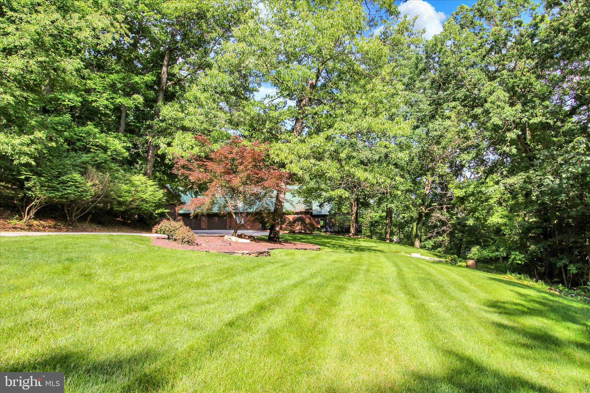 1855 Westwood Road York, PA 17403 - Photo 51 of 60 a view of a swimming pool with lawn chairs under an umbrella