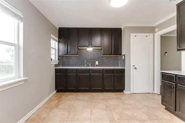 a bathroom with a sink and a large mirror