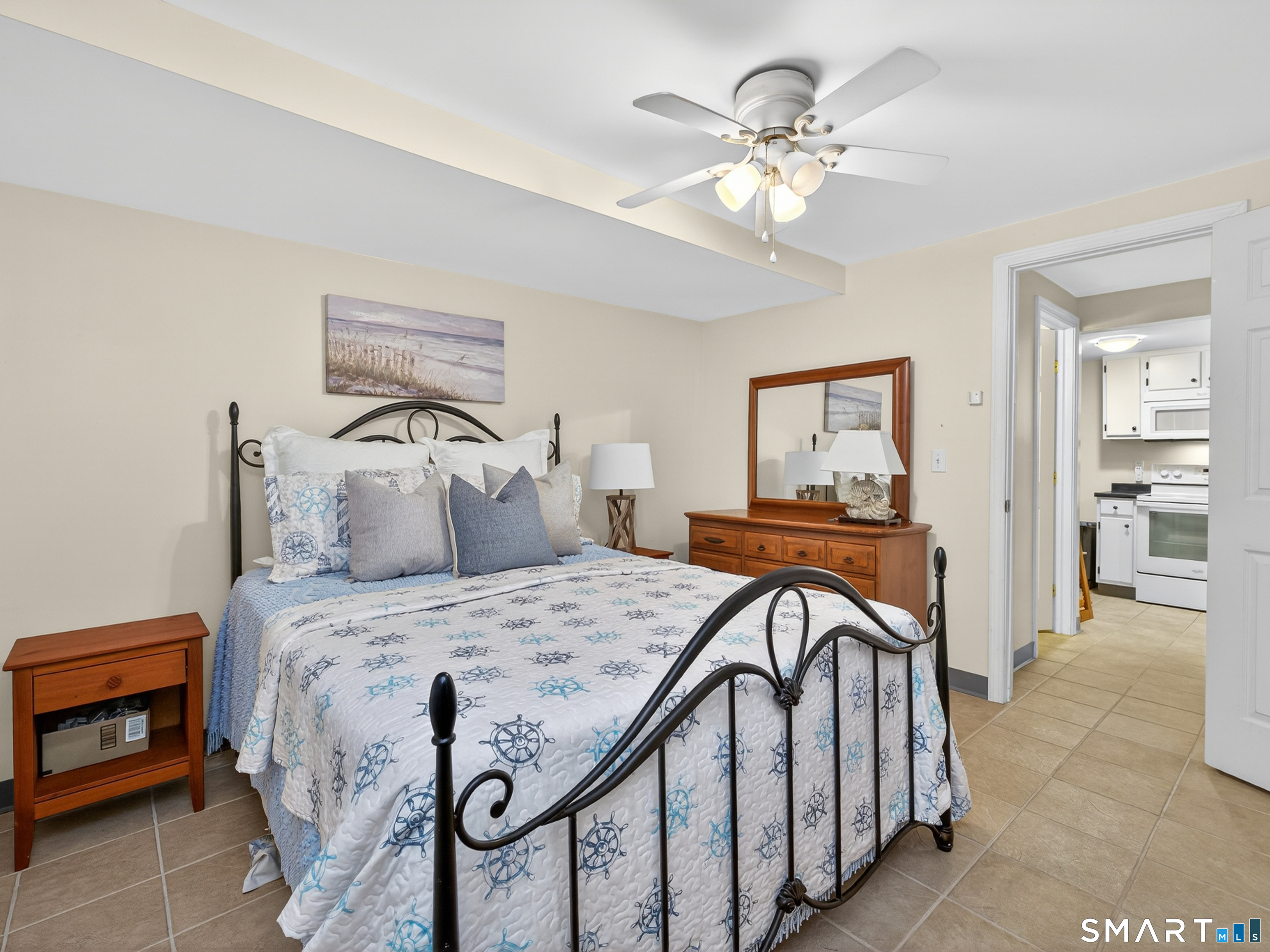 31 Old Colony Road Old Lyme, CT 06371 - Photo 33 of 38 a bedroom with a bed and a chandelier