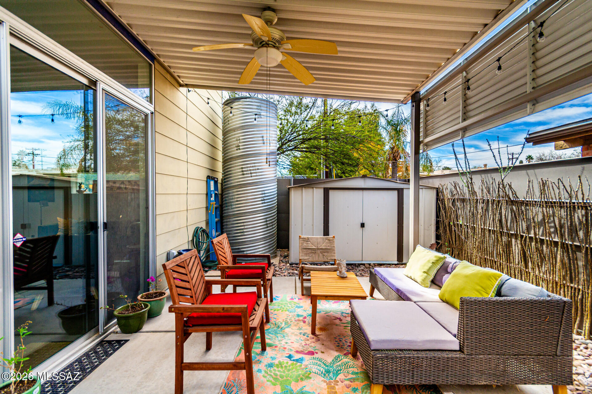 3605 East 3rd Street Tucson, AZ 85716 - Photo 31 of 39 Shaded back patio, perfect space for hosting guests! Featuring a water harvesting system and storage shed.