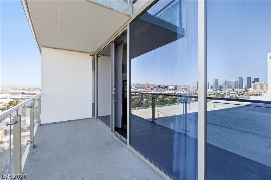 4381 West Flamingo Road, Unit 10306 Las Vegas, NV 89103 - Photo 21 of 26 This spacious balcony offers panoramic city views, ideal for outdoor relaxation and entertainment.