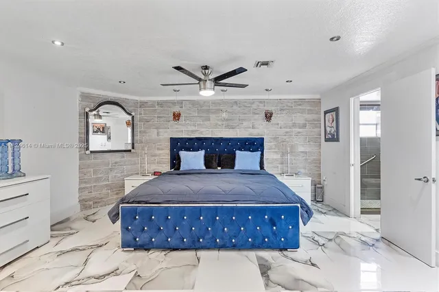 a bedroom with a bed and a fireplace