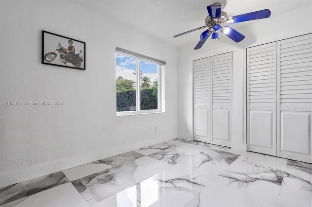 a view of a bedroom with a large window