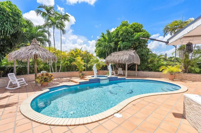a view of a swimming pool with a patio