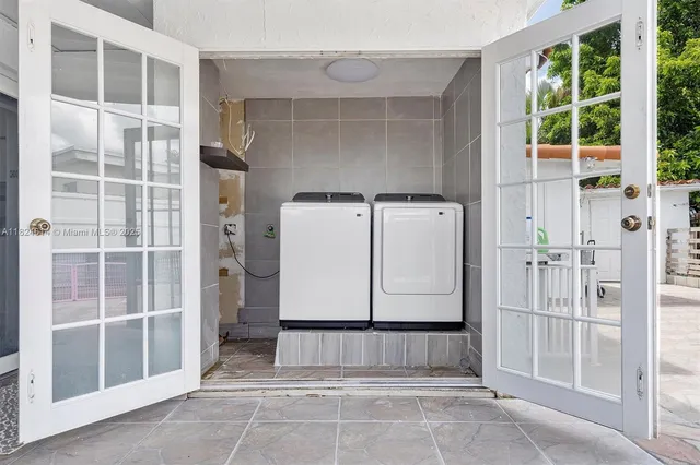 a front view of multi story residential apartment building with yard and green space