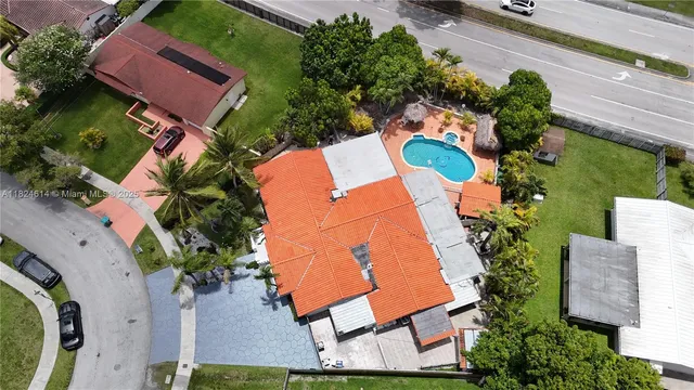 an aerial view of residential house with outdoor space and street view