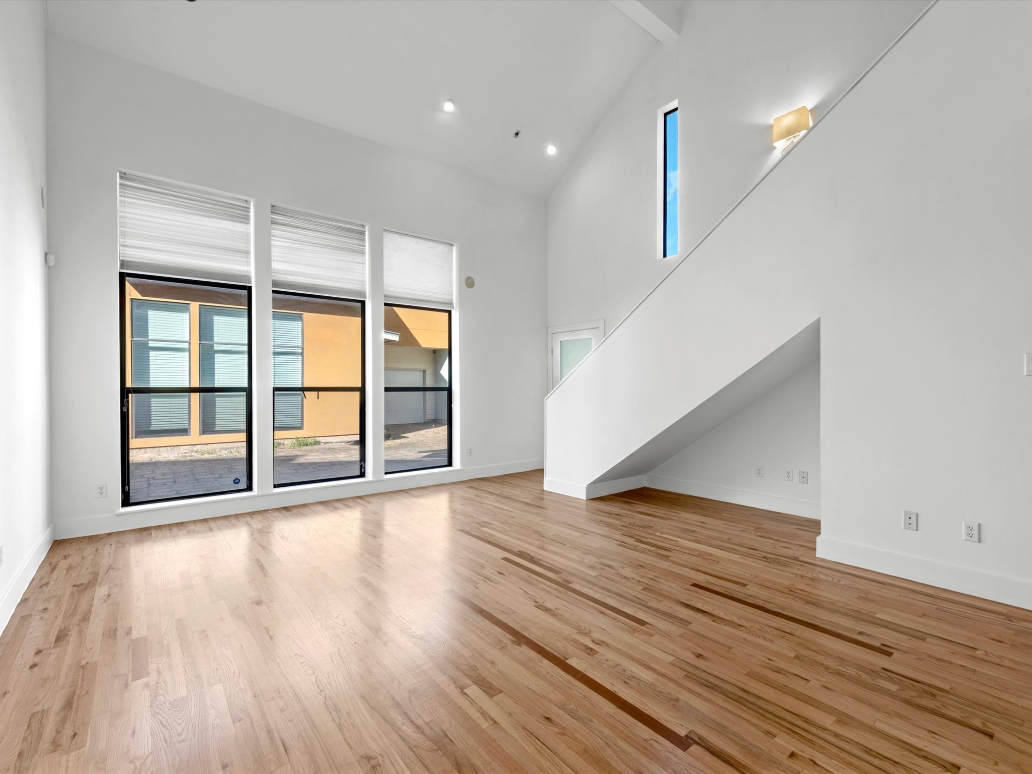 4421 Eigel Street Houston, TX 77007 - Photo 3 of 22 wooden floor in an empty room with a window and wooden floor