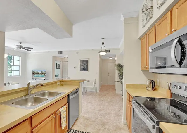 a spacious bathroom with a granite countertop sink and a bathtub
