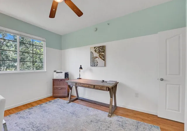 a view of workspace with furniture and window