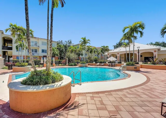 a view of a swimming pool with a patio