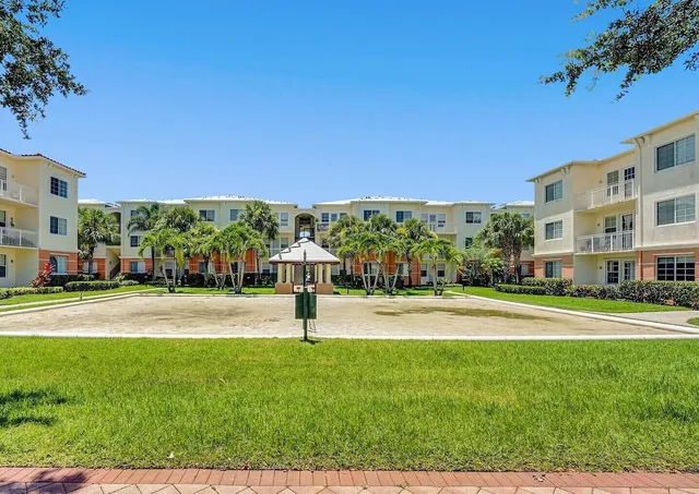 a view of an apartment with a garden