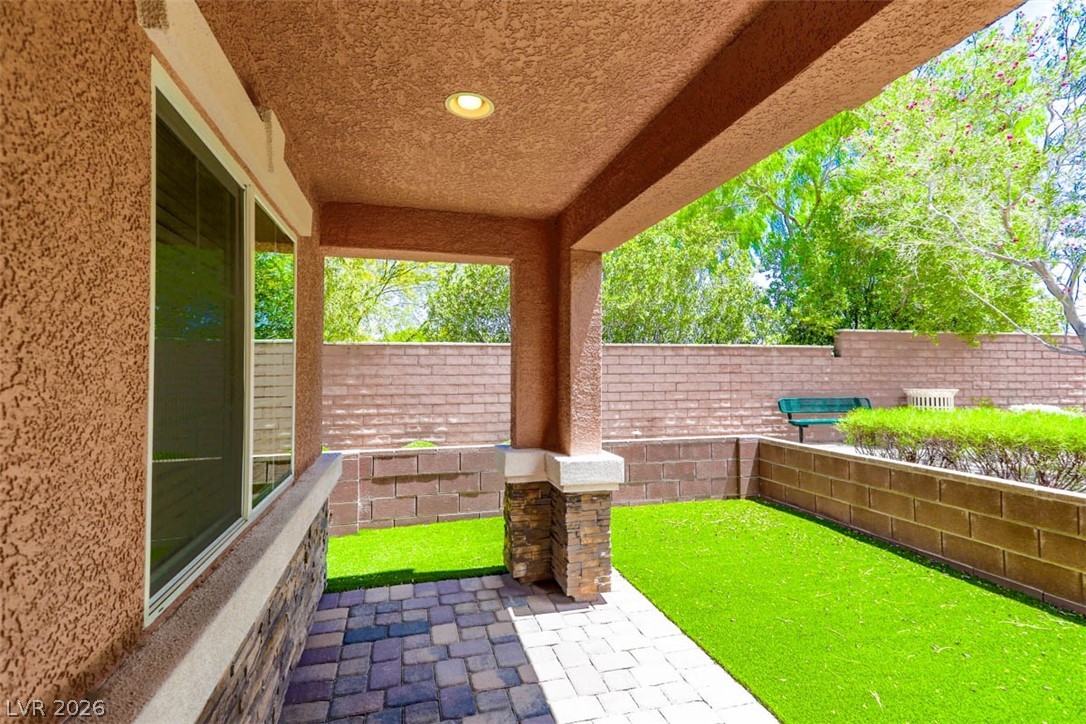 9940 Sable Point Street Las Vegas, NV 89178 - Photo 32 of 40 Fenced backyard featuring a patio area