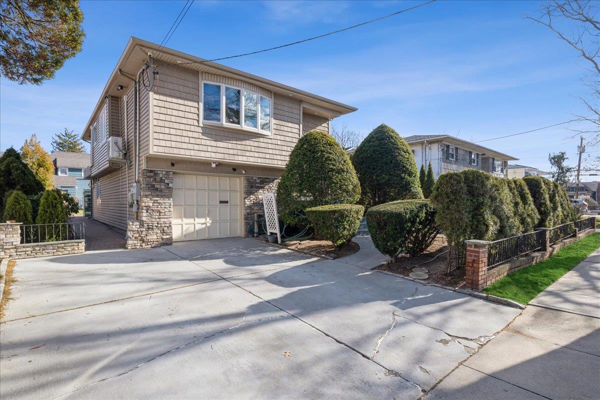 a view of a house with a yard and plants