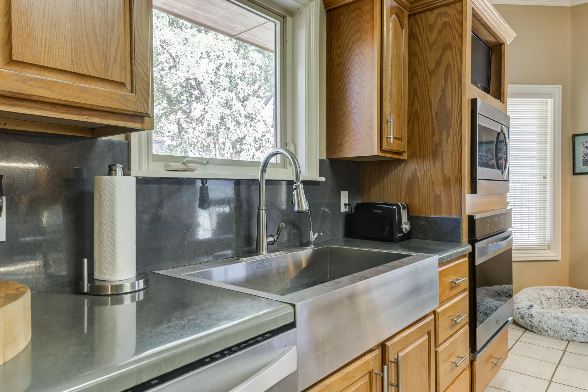 30 West Lakeshore Drive Ransom Canyon, TX 79366 - Photo 17 of 58 a kitchen with granite countertop a sink and a window
