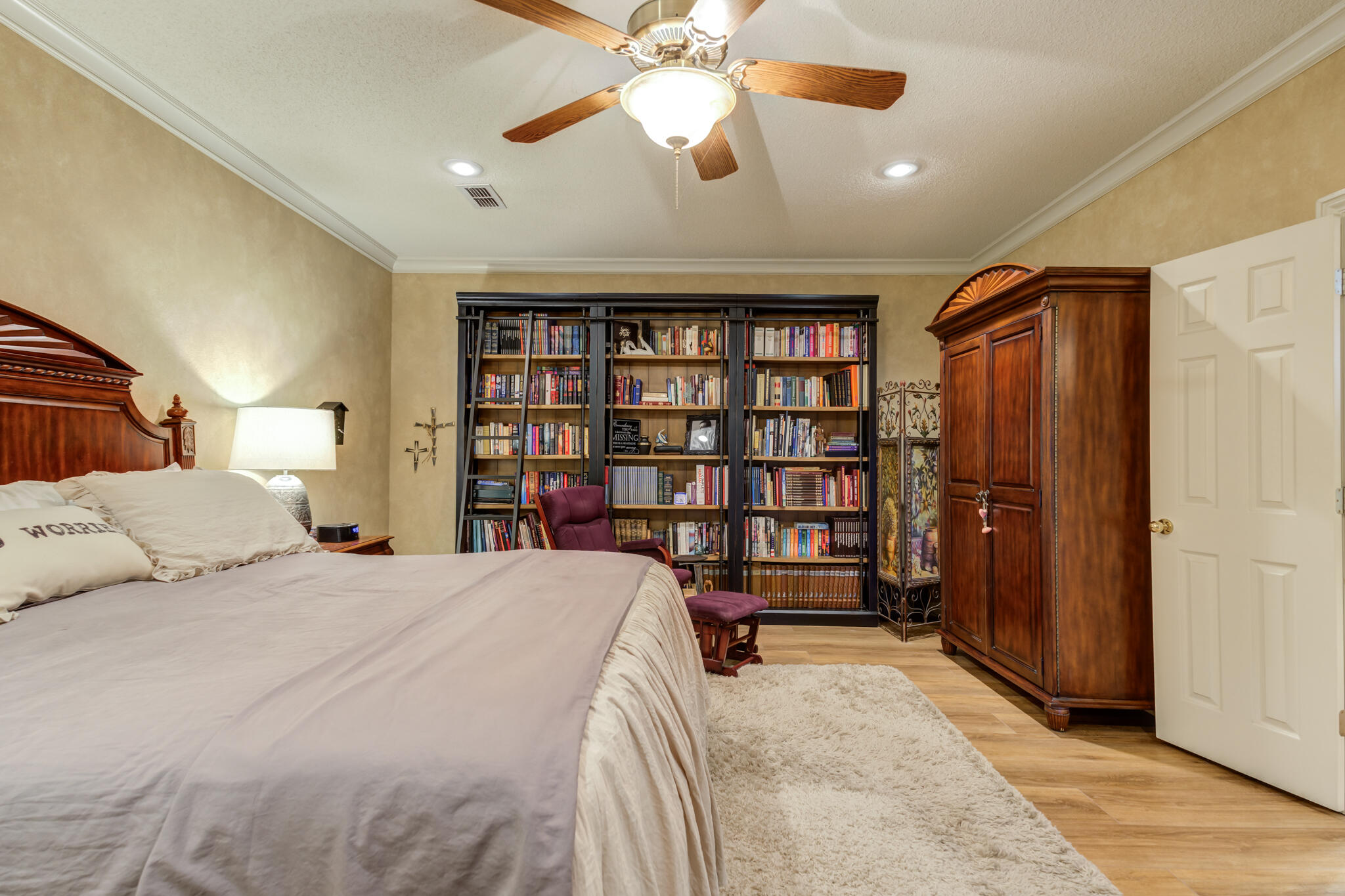 30 West Lakeshore Drive Ransom Canyon, TX 79366 - Photo 28 of 58 a bed room with a bed and a book shelf
