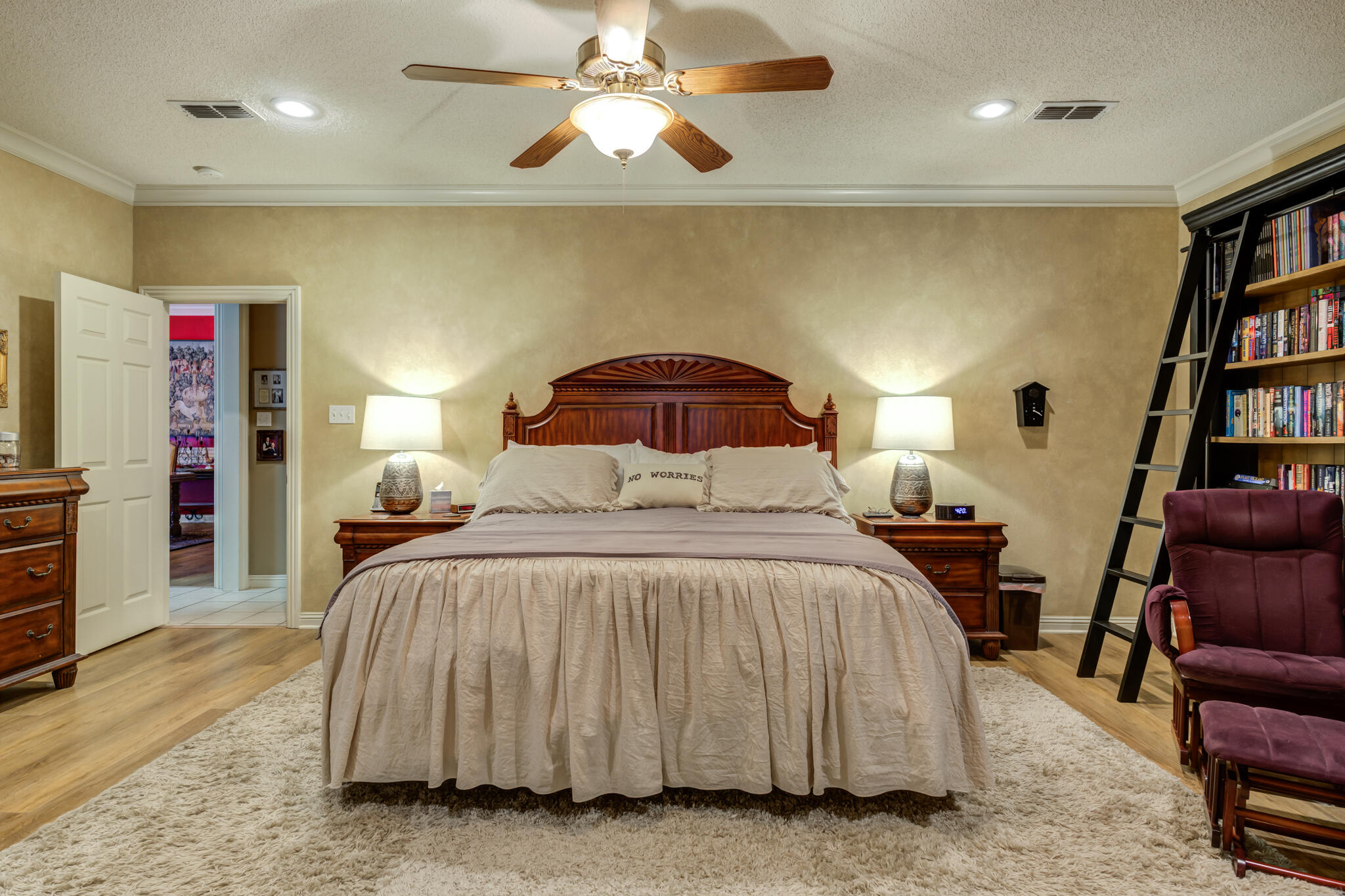 30 West Lakeshore Drive Ransom Canyon, TX 79366 - Photo 30 of 58 a bedroom with a bed and a book shelf