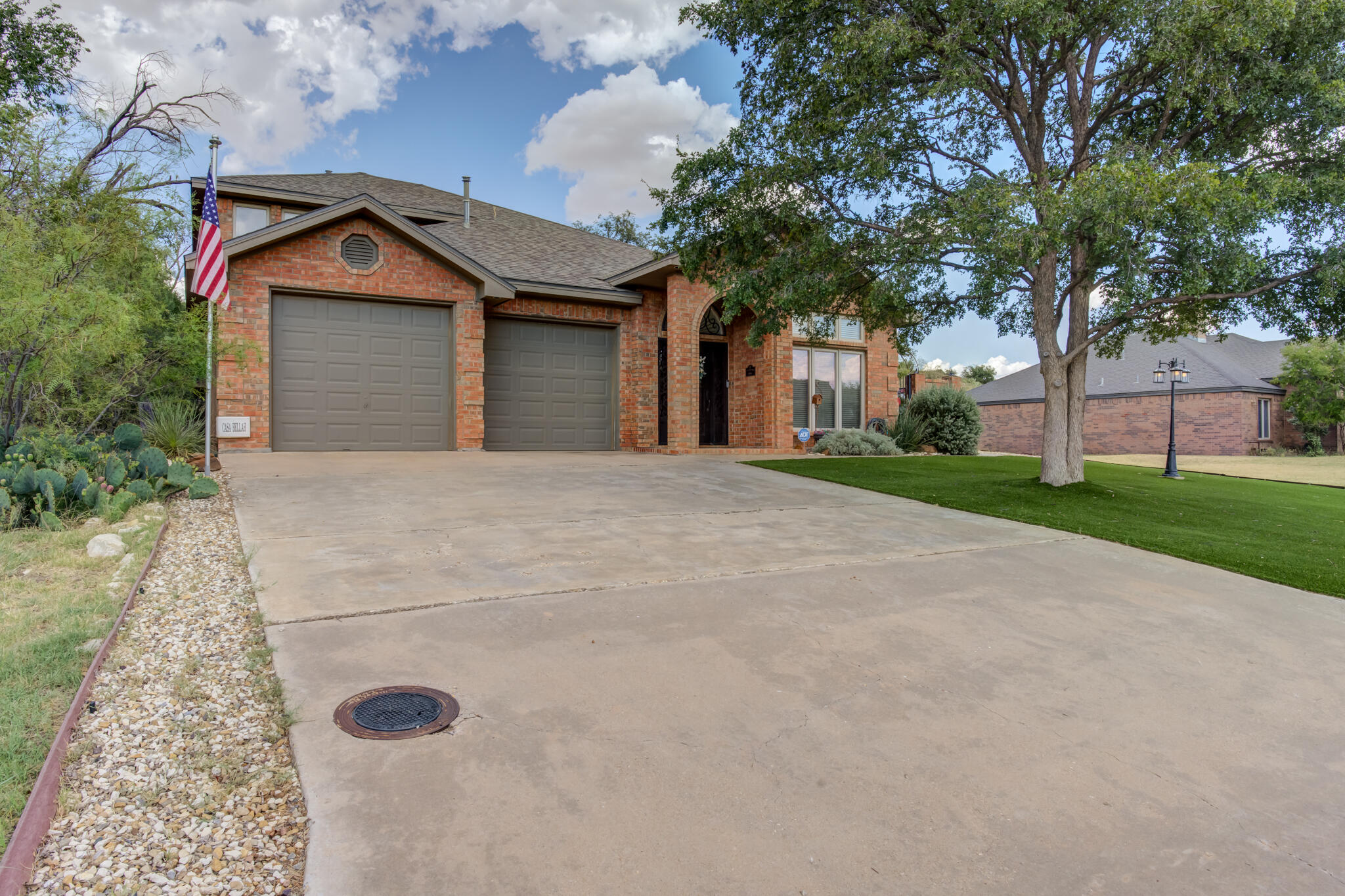 30 West Lakeshore Drive Ransom Canyon, TX 79366 - Photo 3 of 58 a front view of a house with a yard and garage