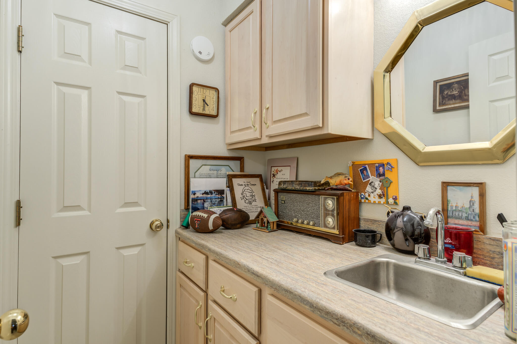 30 West Lakeshore Drive Ransom Canyon, TX 79366 - Photo 41 of 58 a kitchen with a sink and cabinets