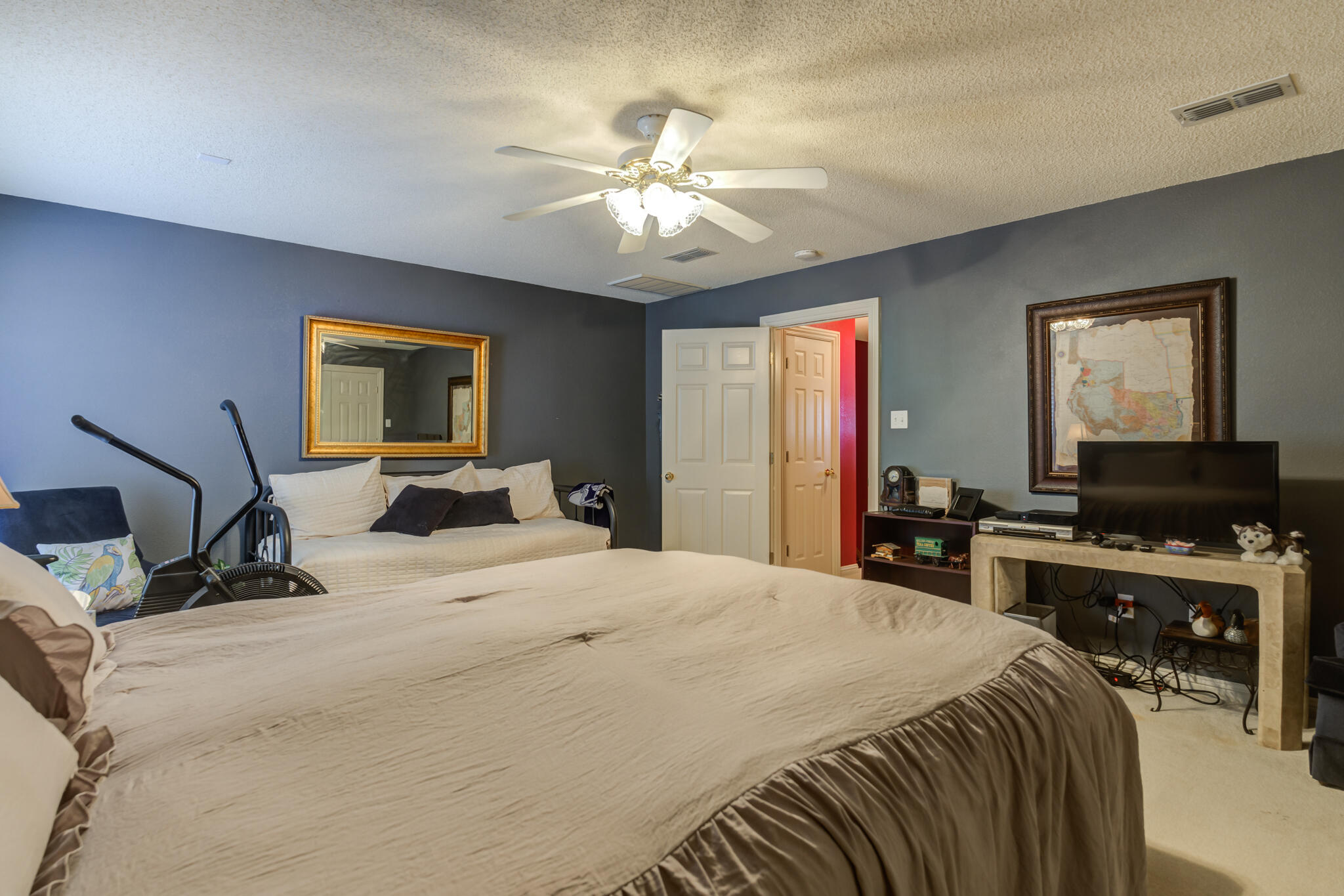 30 West Lakeshore Drive Ransom Canyon, TX 79366 - Photo 48 of 58 a bedroom with a bed and a flat screen tv