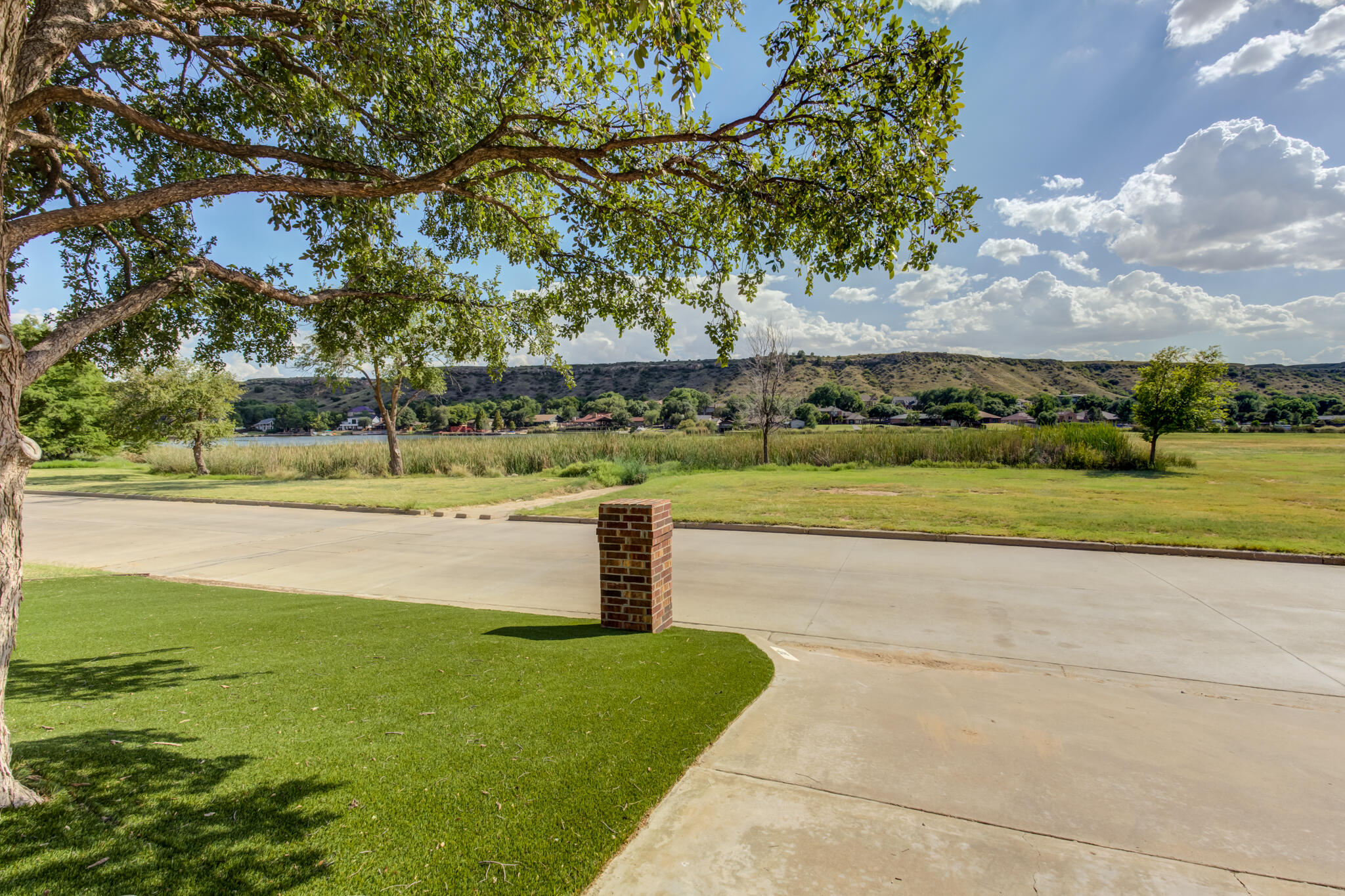 30 West Lakeshore Drive Ransom Canyon, TX 79366 - Photo 58 of 58 a view of a lake with a big yard